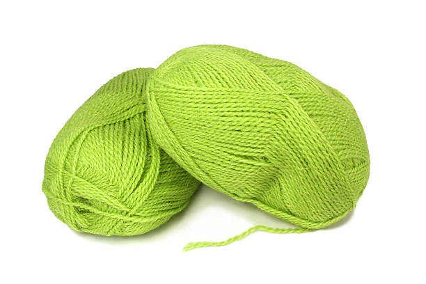 istock Two skeins of green wool yarn. 110960560