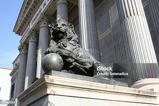 The Sculpture Of Lion Before Spanish Parliament Stock Photo - Download Image Now - Architectural Column, Architecture, Building Entrance