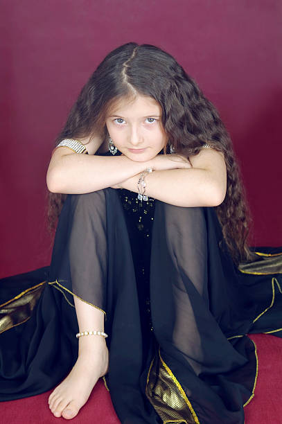 istock girl  sits having drawn in knees 111775669
