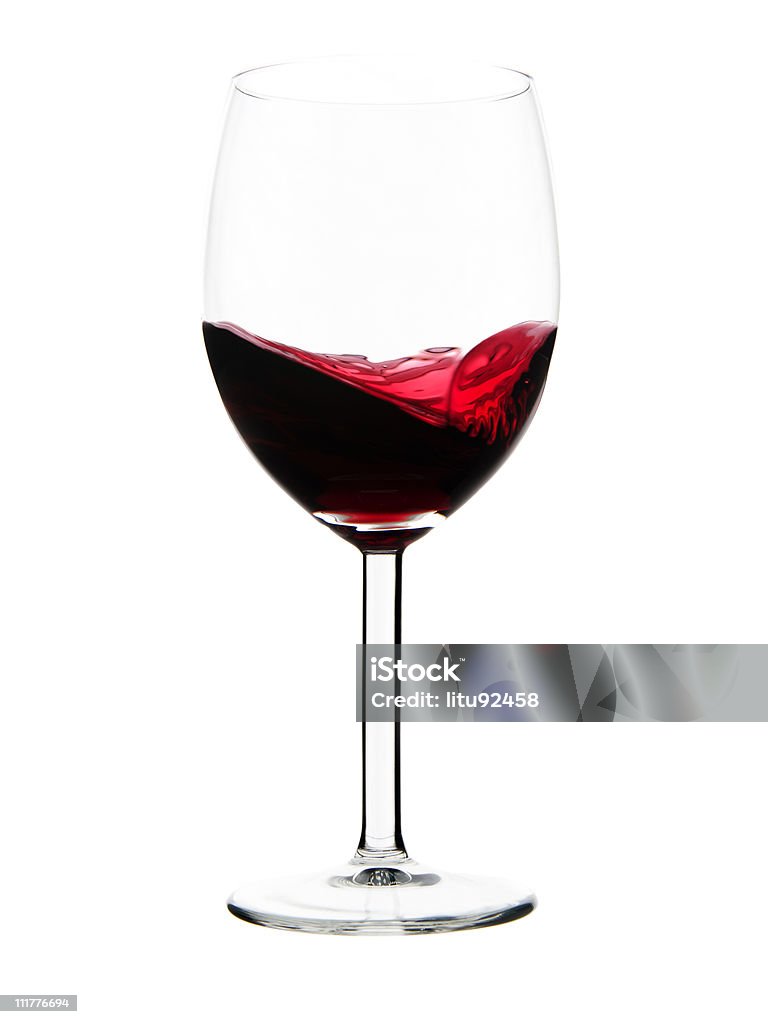 swirling wine Swirling red wine in a goblet wineglass, isolated on a white background, studio shot. Swirl Pattern Stock Photo