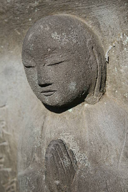 istock Buddist statue marks a small grave in Tokyo 111787775