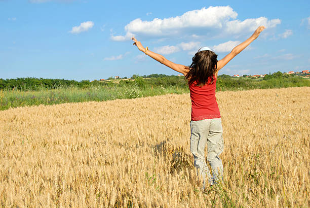 istock Happy girl jumping in wheat field 111813439