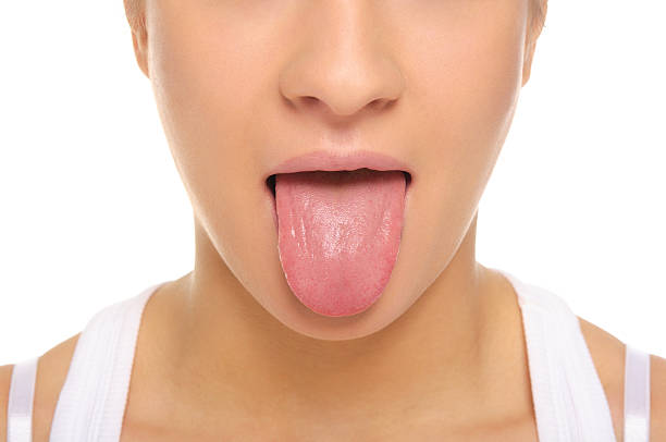 woman stick ones tongue out - mensentong stockfoto's en -beelden
