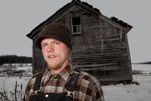 Young Man and His Old Broken Down Shack stock photo