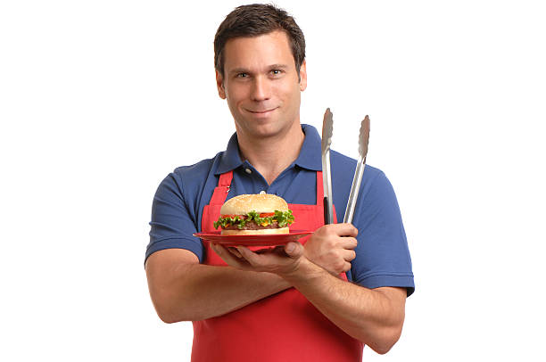 BBQ Chef with Hamburger Apron and Tongs on White