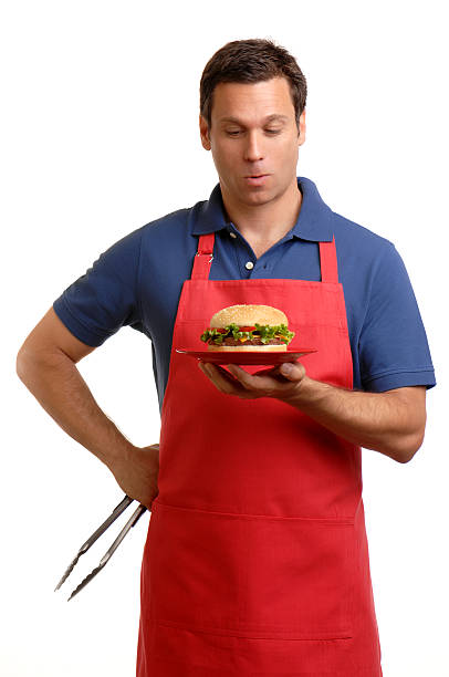 istock Man in Apron with Hamburger Isolated on White Background 111844850
