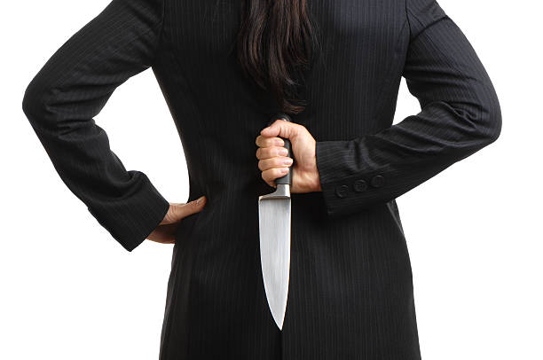 istock Businesswoman HIding Dagger Behind Back Isolated on White Background 111847763