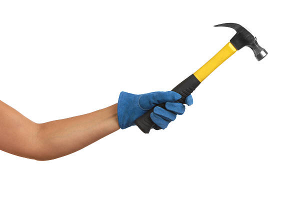 istock Woman's Arm and Gloved Hand Holding Hammer on White 111851869