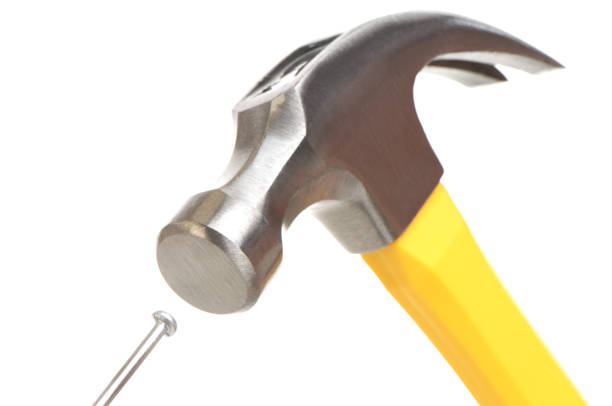 Detail of a hammer striking a nailhttp://www.erichoodphoto.com/istock/homeimprv.jpg