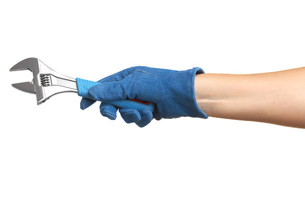 istock Woman's Arm Hand Holding Adjustable Wrench Isolated on White Background 111852370