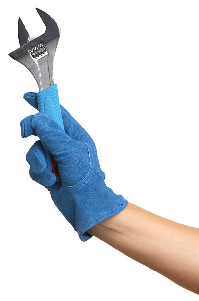 istock Woman's Arm and Hand Holding an Adjustable Wrench on White 111852377