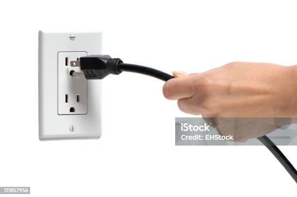 Womans Hang Pulling Plug Out Of Socket On White Stock Photo - Download Image Now - Electric Plug, Electrical Outlet, Pulling