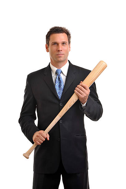 Businessman with Baseball Bat Isolated on White Background