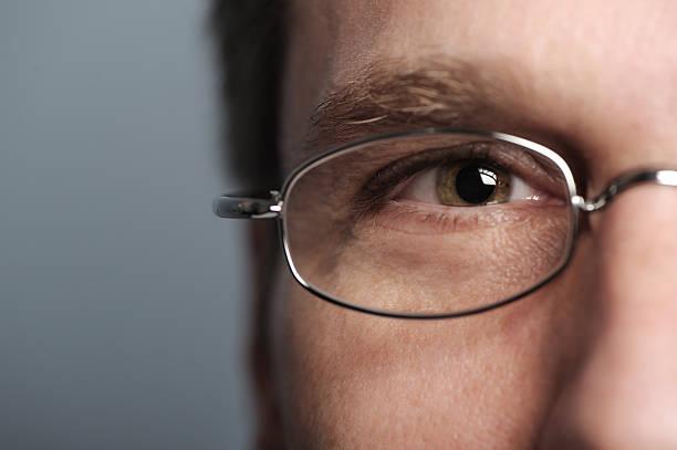 istock Man's Eye with Glasses Close up on Gray 111873167