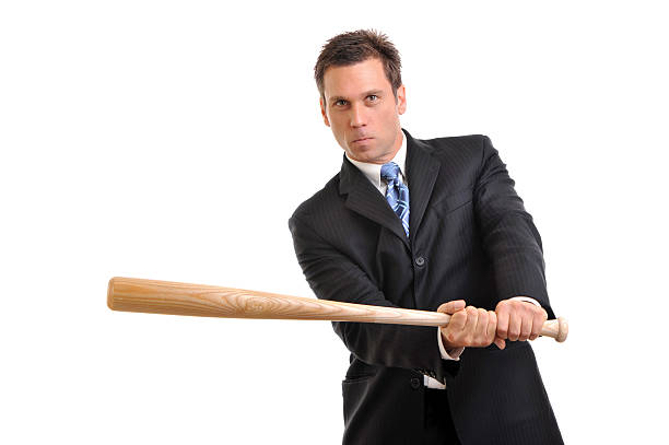 istock Businessman Swinging Baseball Bat on White 111884969