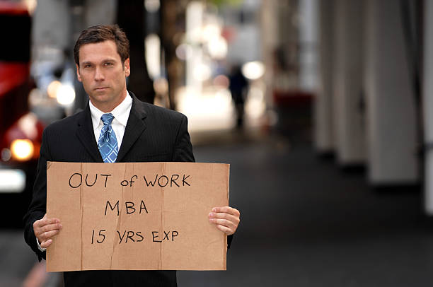 istock Unemployed Businessman Holding Sign 111884983