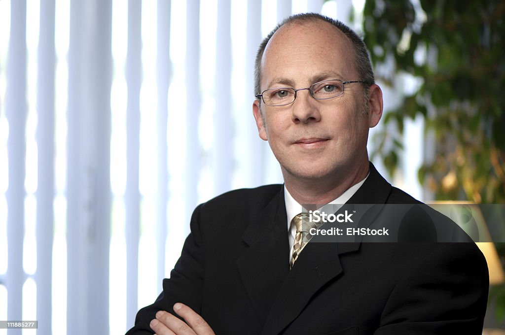 CEO Businessman Portrait in Office CEO in office with arms crossed 40-49 Years Stock Photo