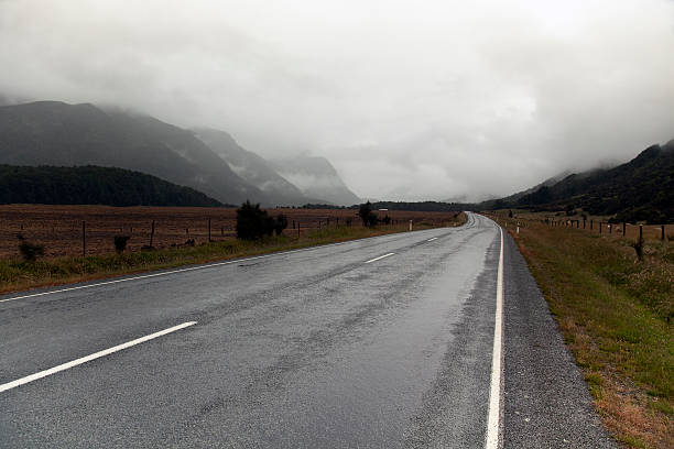 istock country mountain road in rain and clouds 111894331