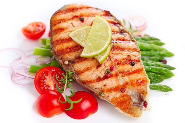 istock Grilled salmon with lime, asparagus and cherry tomatoes 111903596