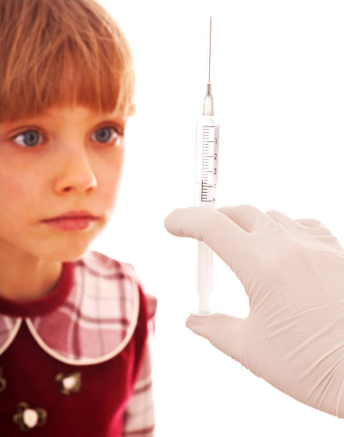 istock Child look at hand with syringe. 111907670