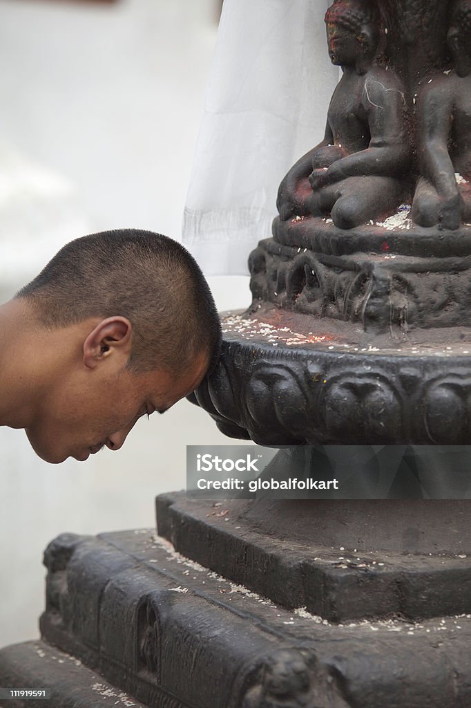 Buddhist prayer at Boudhanath stupa closeup  20-29 Years Stock Photo