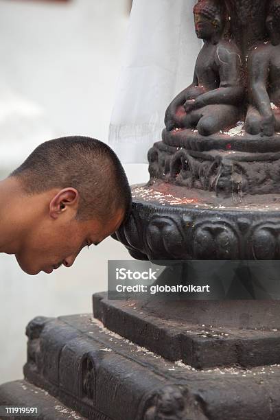 Buddhist Prayer At Boudhanath Stupa Closeup Stock Photo - Download Image Now - 20-29 Years, 25-29 Years, Adult