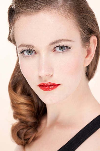 Pretty young woman with red lips stock photo