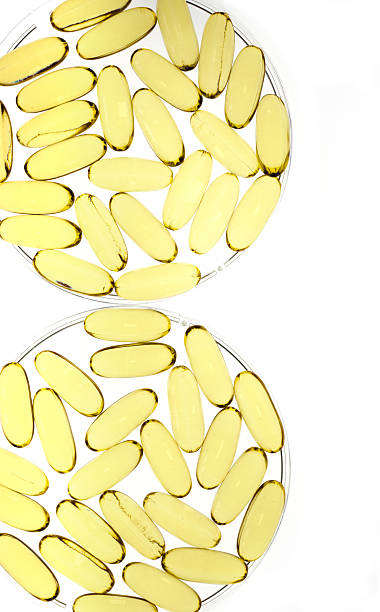 istock Two petri dishes with gold gel capsules 111920984