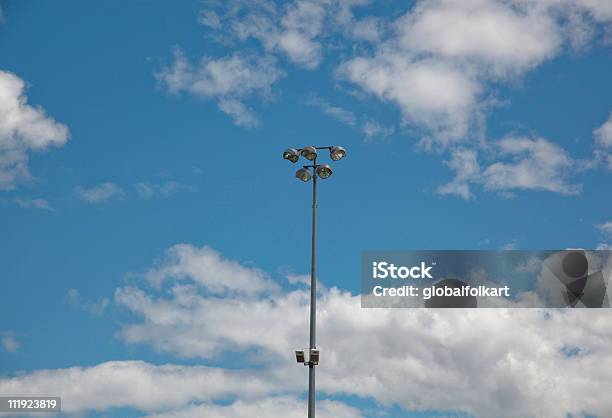 Stadium Lighting Blue Sky Clouds Stock Photo - Download Image Now - Blue, Cloudscape, Color Image