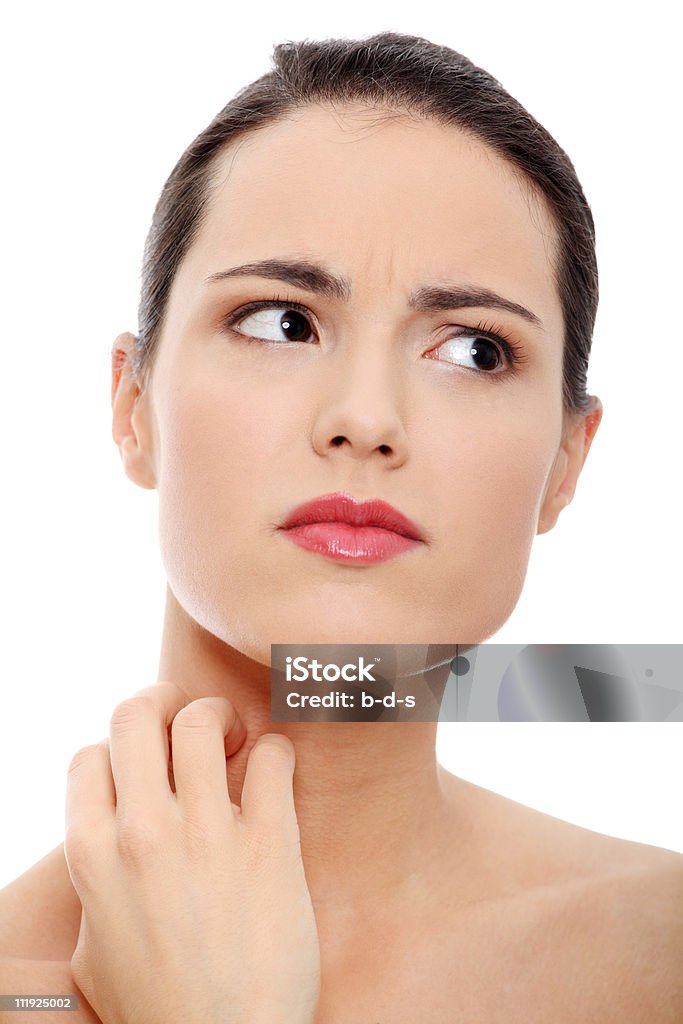 Beauty girl with perfect skin scratching her neck  20-29 Years Stock Photo