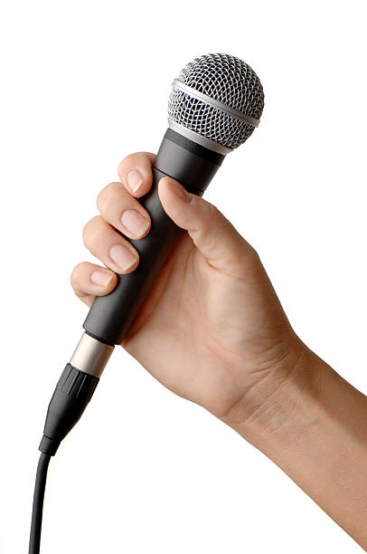 istock Woman's Hand Holding Vocal Microphone Isolated on White Background 111926753