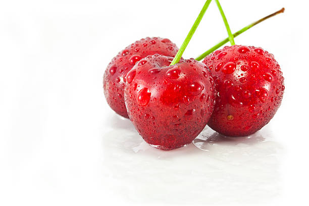 Cerejas em branco - fotografia de stock