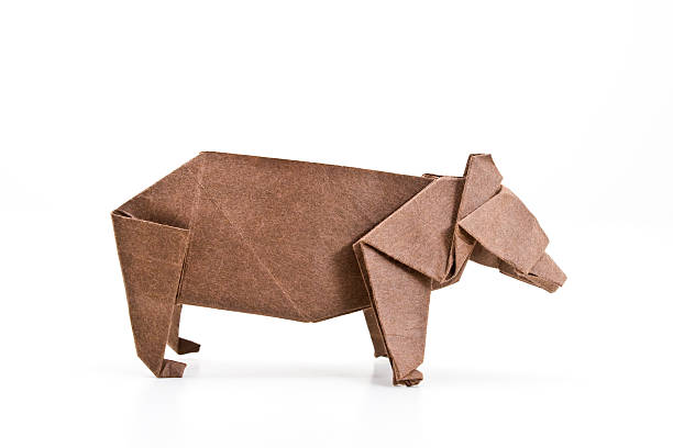 istock A brown paper origami bear on a white background 111930849