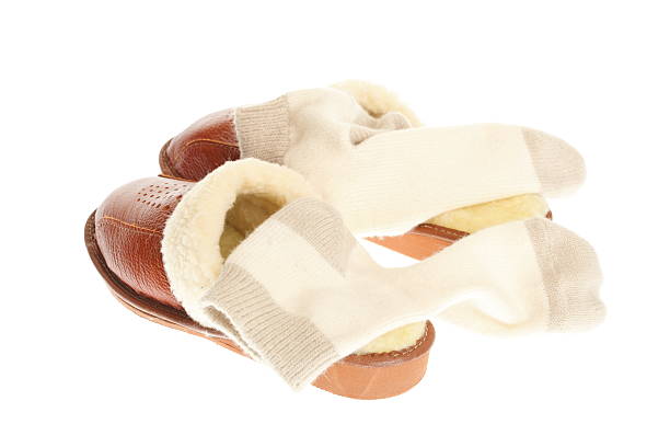 istock brown slippers and sock isolated on a white background. 111932747