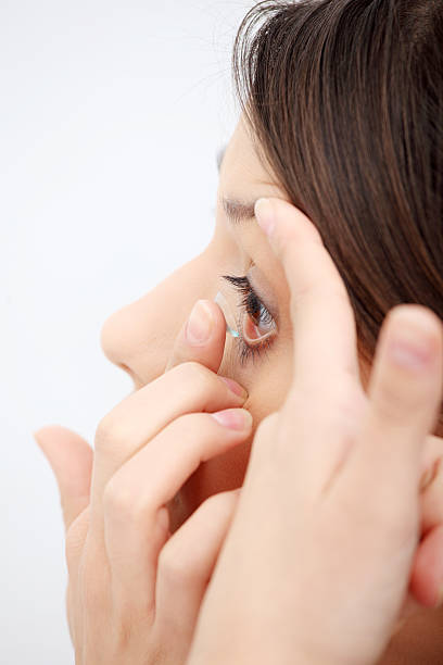 istock Girl inserting contact lens 111932939