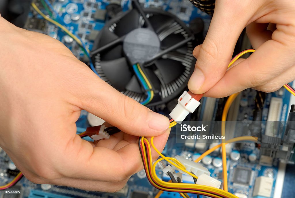 Working on computer parts  Color Image Stock Photo