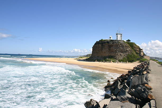 Ocean-side view of Nobbys Head Light in Newcastle, Australia
