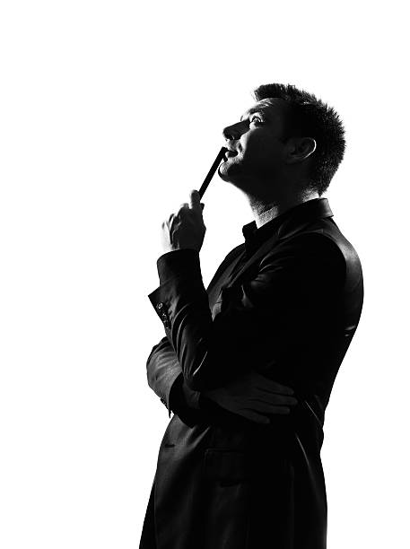 istock silhouette  man  thinking pensive looking up portrait 111942416