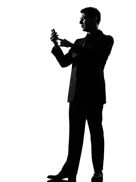 istock silhouette  man on the phone sms text messaging 111942617