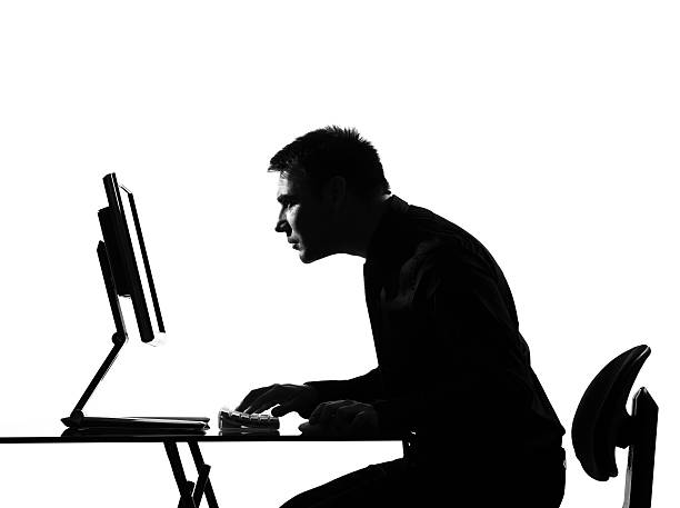 istock silhouette man  computing staring at the monitor 111942754