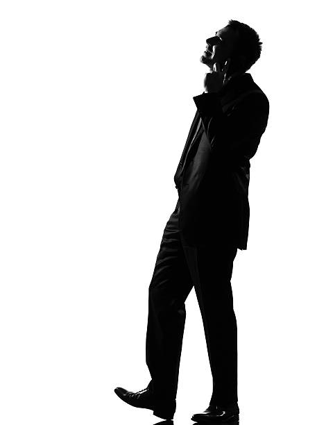 istock A silhouette of a man talking on the phone 111942784