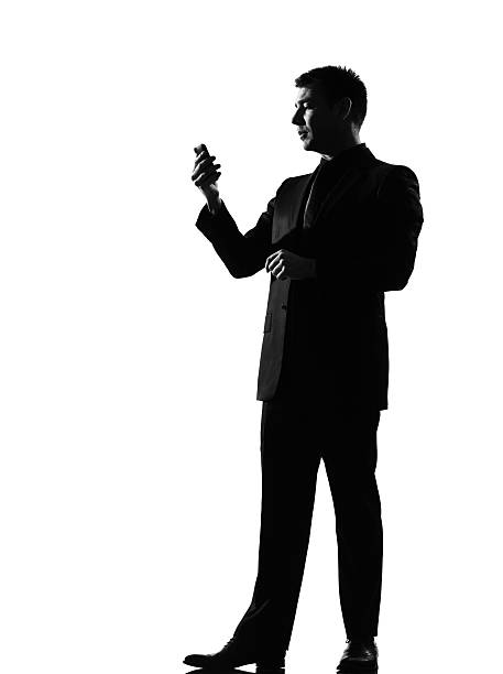 Silhouette of man using smartphone over a white background