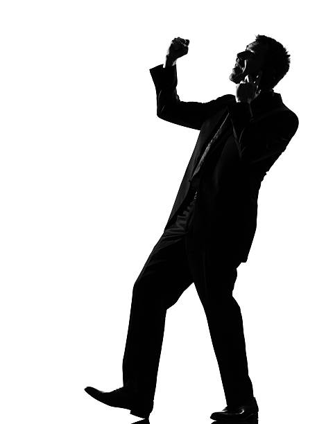 istock silhouette  man  winner on the phone 111942874