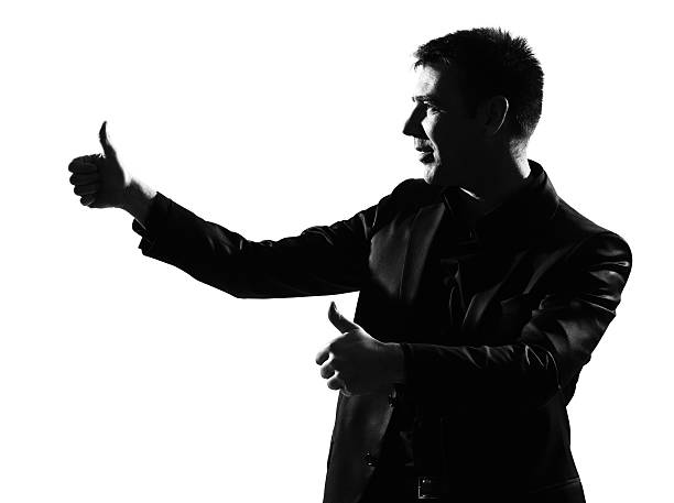 istock silhouette  man  winner thumbs up 111943044