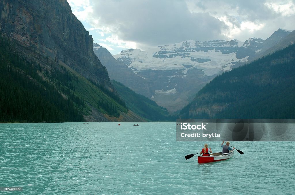Canoeing Canoeing on Lake Louise,Canada. Banff National Park Stock Photo