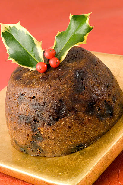 istock Christmas pudding on gold plate and red tablecloth 111948682