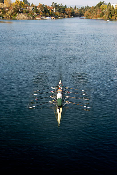 istock Quad Shell Racer with Four Rowers on Autumn Lake 111949506