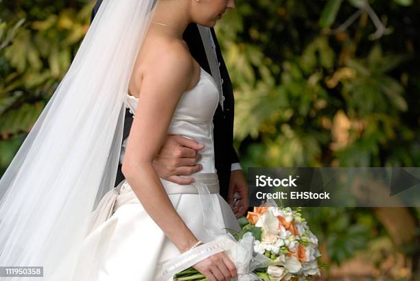 Bride And Groom Walk Together After Ceremony Stock Photo - Download Image Now - Adult, Bouquet, Bride