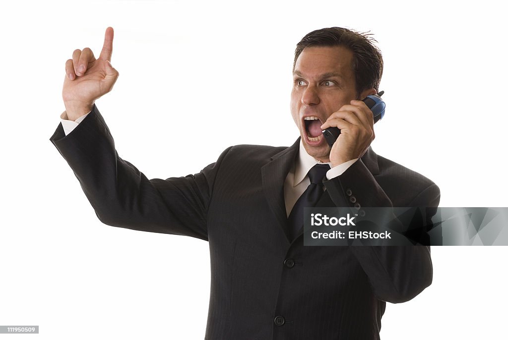 Businessman Screams into Telephone while Gesturing Isolated on White Background A suavely dressed businessman has had all he can take Bizarre Stock Photo