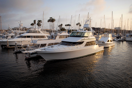 A tidy little yacht sits moored to a dock in Marina Del Rey, California